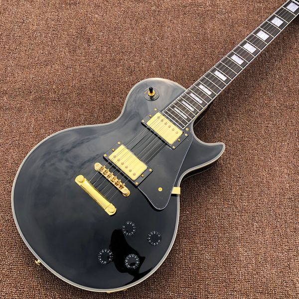 

electric guitar,rosewood fingerboard,gold hardware,black custom