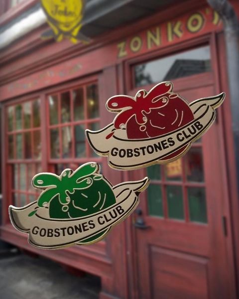 

pins, brooches gobstones wizarding game pin ''every time a point is conceded, winning stone squirts foul-smelling liquid into lose, Gray