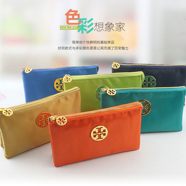 

new fashion multi-color one pull three open holding women's purse in hand