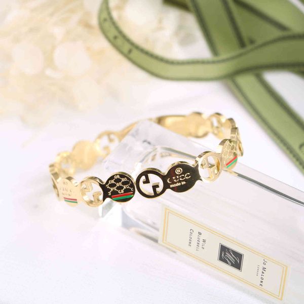 

2021 new jewelry decorated titanium steel ancient family circle stitching red and green contrast hollow out letter spring open bracelet, Black