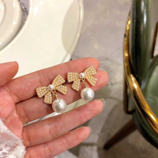 

needle delicate bowknot earring selling sweet korean temperament golden plating simulated pearl stud earrings for girl, Golden;silver