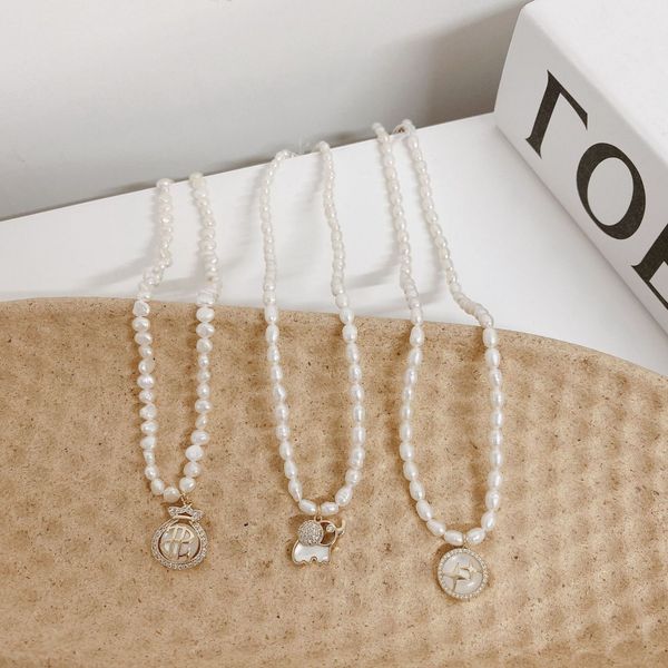 

japanese and korean temperament celebrity style fresh water pearl necklace creative advanced sense cat's eye stone shell clavicle chain, Black