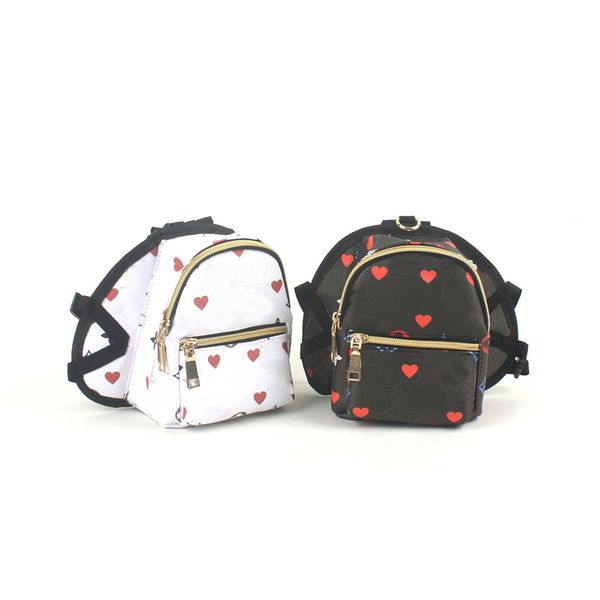 Encantador bolso para mascotas en forma de corazón Ropa para perros de moda Clásico Vintage Cachorro Mochila Casual Mascotas al aire libre Mochilas Bolsas de cuero ajustables para perros