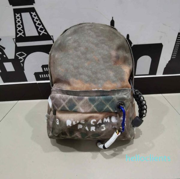 Mochila de emenda de designer clássico bolsas de lazer esportivas de graffiti masculinas e femininas camuflada em lona bolsa de viagem de grande capacidade