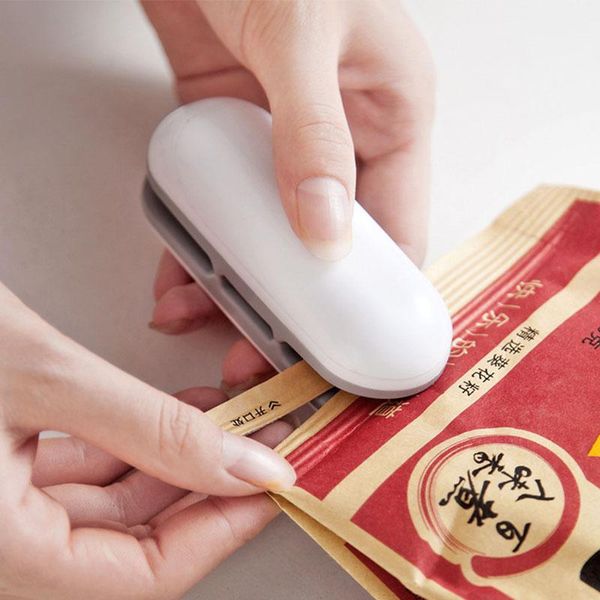 

sealing machine household portable cutting mini dual-use double-sided snack plastic bag hand press clips