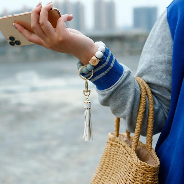 

keychains 2021 creative summer silicone bead wrist keychain europe and america wooden tassel anti-lost key ring pendant, Silver