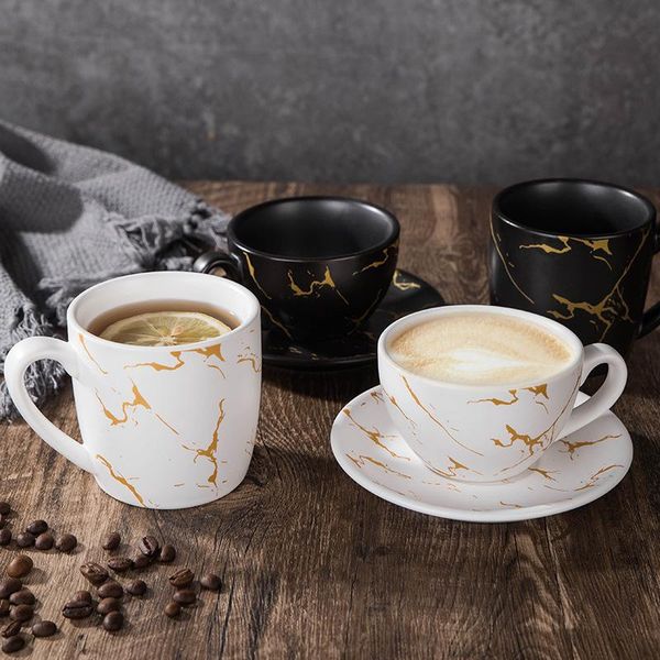 

mugs marble coffee cup black-and-white and saucer with spoons of milk mug