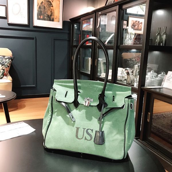 

fan weiqi's same fashion military canvas personalized graffiti medal bag, portable messenger bag