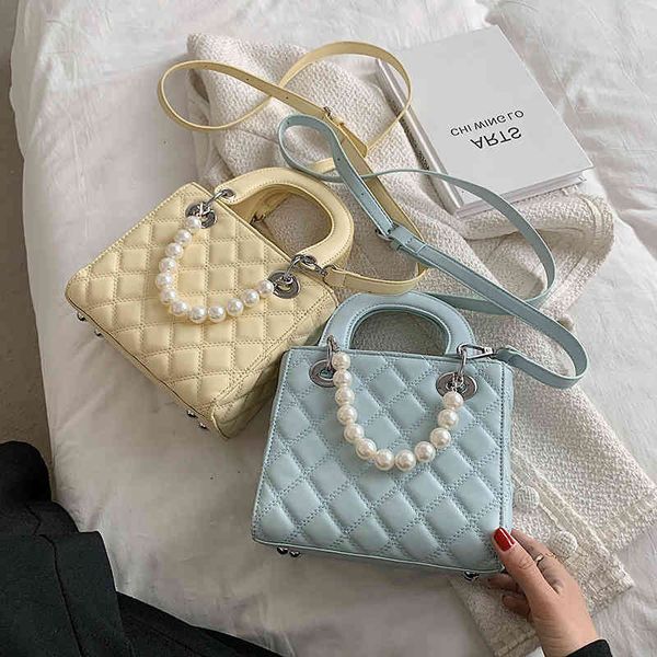 

summer net new red 21 korean version tide lap messenger fairy lingge fashion pearl hand diana bag