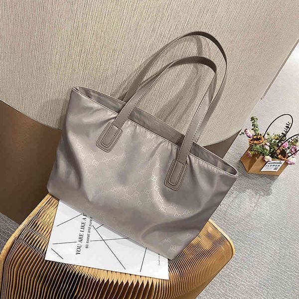 

Large capacity hand-held women's bag versatile Travel Backpack Shopping Bag Tote