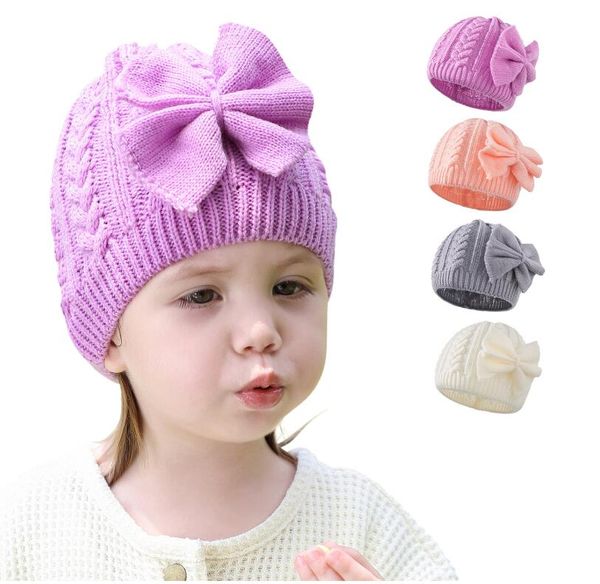 Bellissime neonate Cappelli di lana di colore puro Bambini Berretti lavorati a maglia con fiocco Bowknot Bambini Autunno Inverno Cappello Berretto da ragazza 4 colori