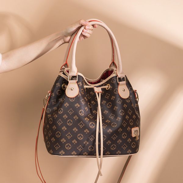 

factory wholesale 2021 new fashion slant span women's printed shoulder large capacity handbag drawstring bucket bag