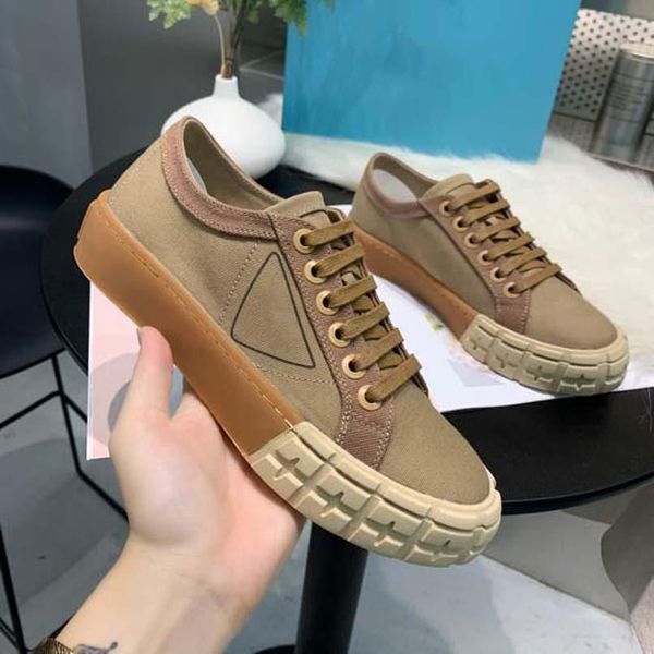 

luxury women sneakers designer shoes lnspired by motorcycle wheels a nylon gabardine sneaker has thick rubber sole ariangular logo adorns th, Black