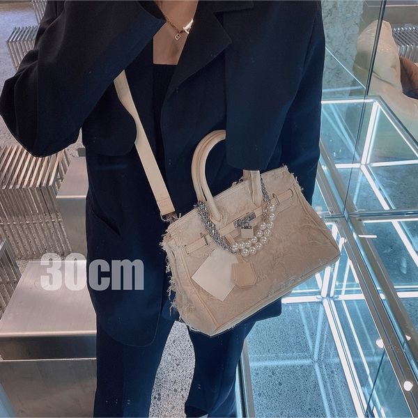 

small handmade denim y splicing beggars army canvas kelly hand bag tide