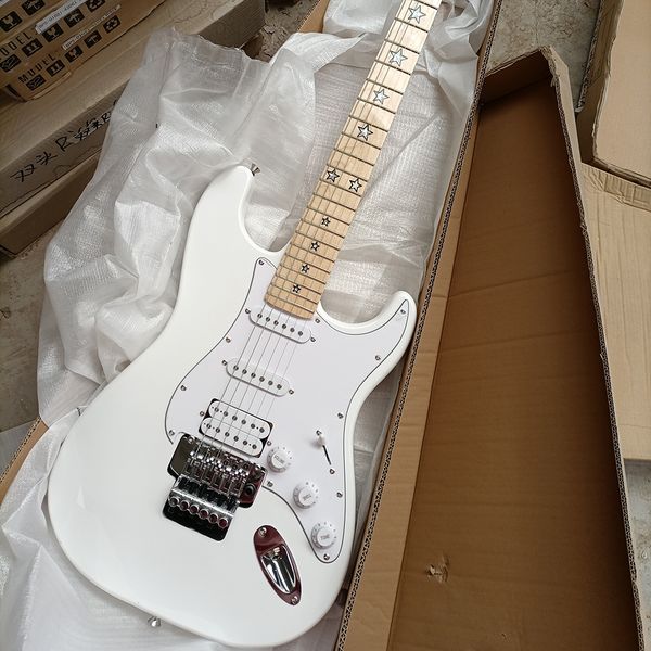 

white electric guitar with tremolo bar,maple fretboard