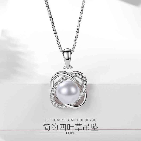 Versione coreana della donna sterling del ciondolo dell'argento sterling del trifoglio di lusso della luce S925 in linea con l'erba fortunata rotante della perla, lo stesso stile in Giappone e