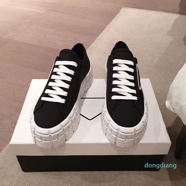 

designer- casual shoes rubber platform inspired by motocross tires defines the unusual design of these nylon gabardine sneakers, Black