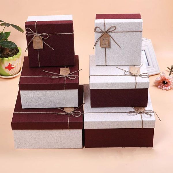 

gift wrap square shape textured paper box for holding gifts or flowers tied with a small tag wishes have happy life