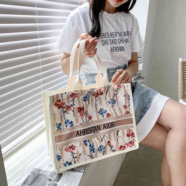 

2022 latest models handbag wholesale graffiti printed tote summer portable canvas large capacity trendy shoulder