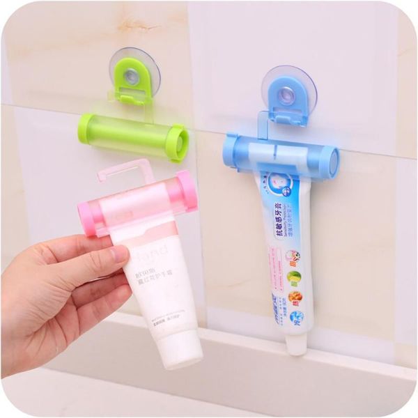 

toothbrush holders toothpaste dispenser squeezer creative rolling tube suction cup hanging holder