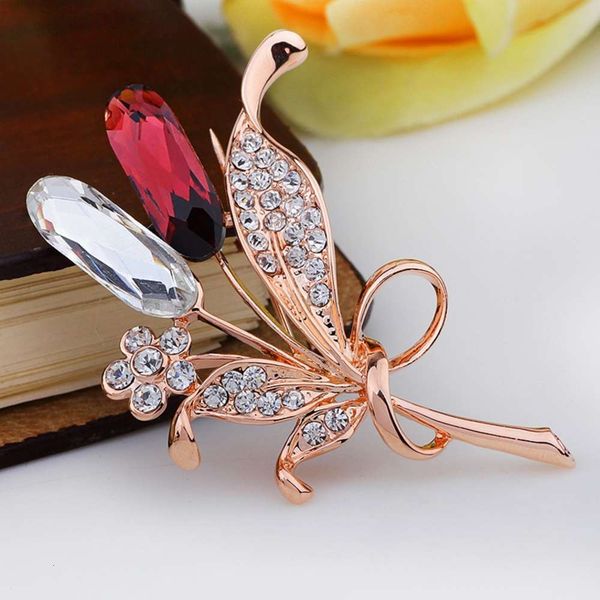 

gold spike with diamond brooch, Gray