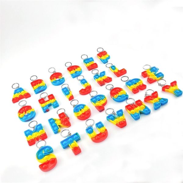 

26 english letters color bubble music key chain rat killing pioneer pendant ring silicone fingertip toy