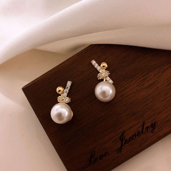 

bowknot pearl earrings feminine temperament small earrings fashion silver needles