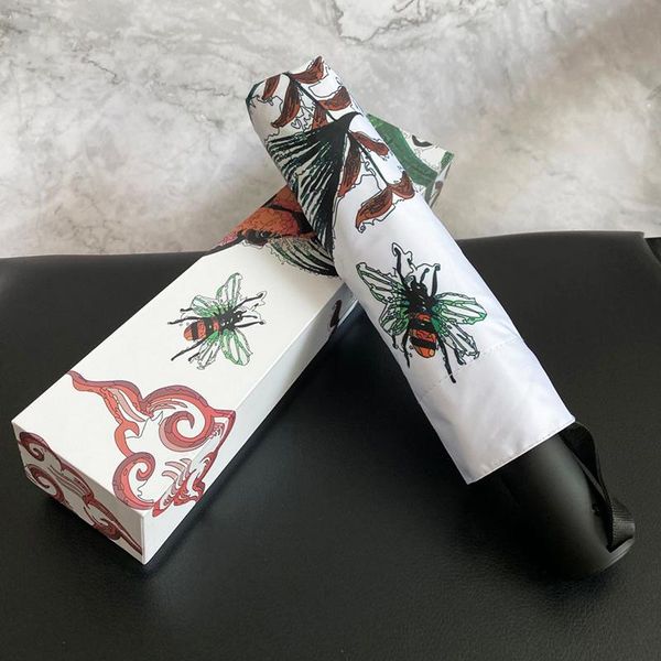 

umbrellas trendy brand automatic three-fold folding umbrella black glue coated sun anti-uv rain or