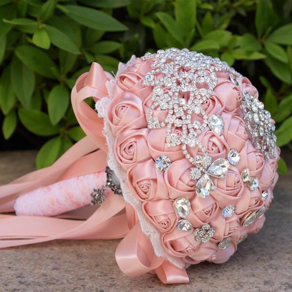 

wedding flowers bride holding artificial bouquet ribbon rhinestone crystal beaded decoration groom dance