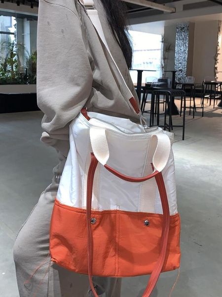 

briefcases 22ss large-capacity can be hand-held or single-shoulder ader error bag men women fashion four seasons tiny spark lil peep