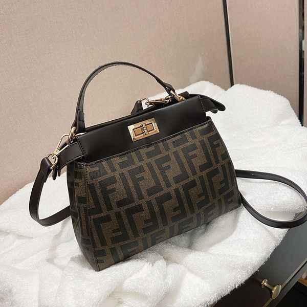 

65% off store online luxury handbags family small design new style on the line, popular texture, foreign style, versatile printing, carrying