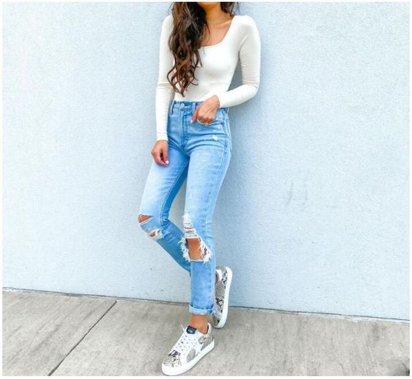 Jeans da donna abbinati a molti tipi di scarpe Moda europea americana per il tempo libero Fascino di strada personalità pantaloni leggings elastici con foro a strappo in cotone con cerniera dritta