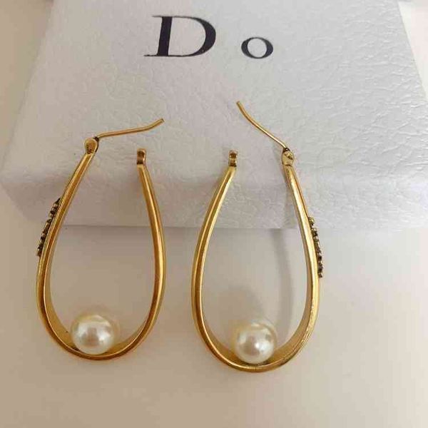 

70% off 2021 new egg shaped letter pearl brass 925 silver needle earrings female