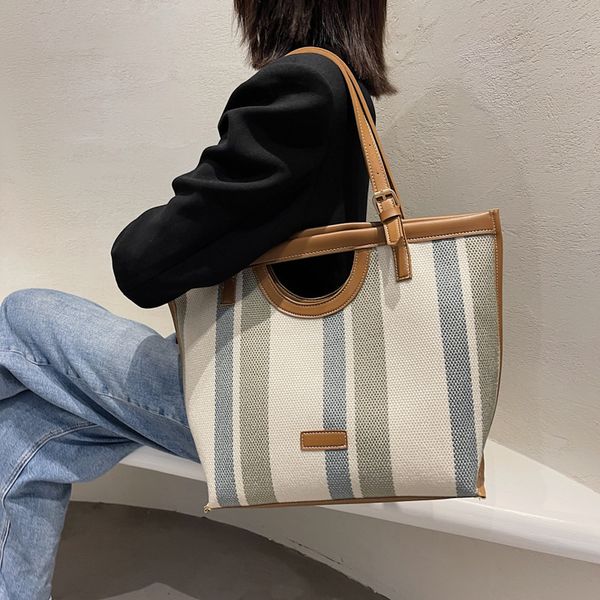 

factory direct sale 75% off 2021 lady temperament stripe college style commuting advanced sense of high-capacity one shoulder tote women