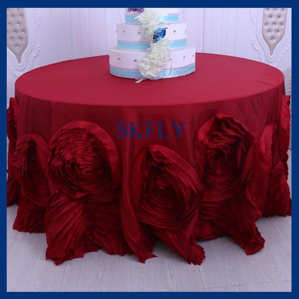 

fancy wedding round wine or dark red table cloth with rosette flower