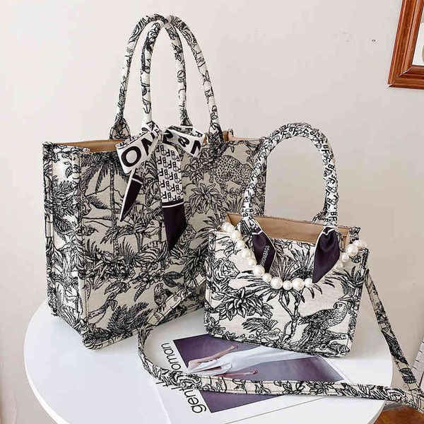 

2022 latest luggage factory wholesale women's shoulder bag canvas printed large capacity portable bags