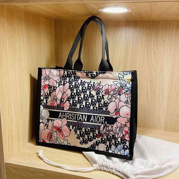 

2022 designer s new canvas single shoulder tote bag ins style minority graffiti commuter fashion trendy women's bag