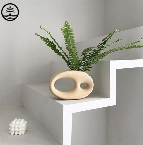 

ta simple and modern abstract art circular ceramic vase dried flowers floral organ craft table home decoration r6622 vases