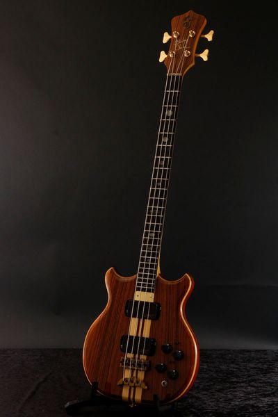 Maßgeschneiderte Alembic Brown Ash 4-Saiter-E-Bassgitarre mit durchgehendem Hals, 5-lagigem Hals, Goldbeschlägen, Abalone-Intarsien