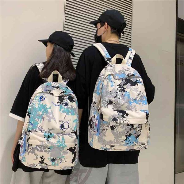 

backpack female new korean graffiti astronaut couple backpack junior high school students leisure schoolbag