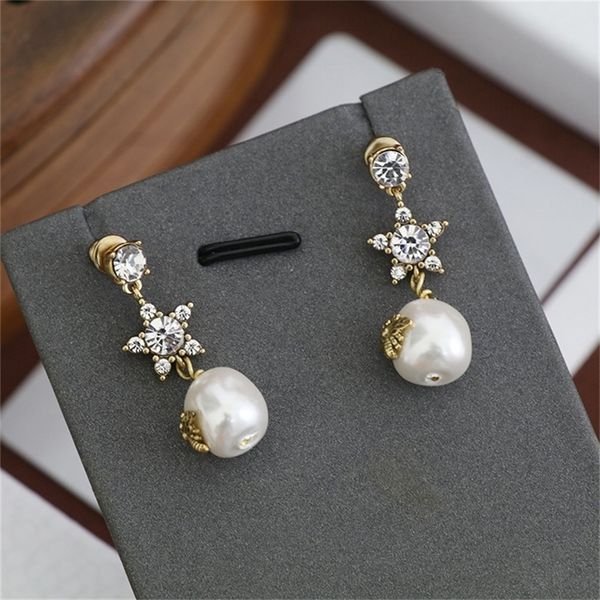 

85% off factory clearance family pearl earrings female new red diamond, Golden