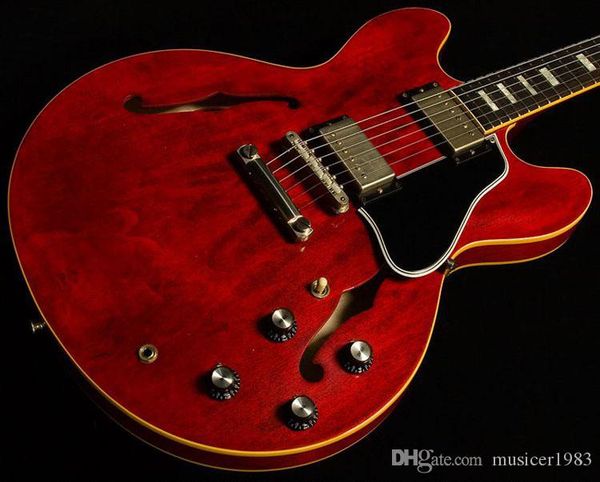 

jazz electric guitar, semi hollow body, aged winered,