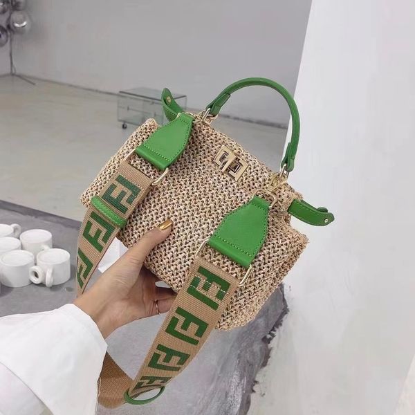

fend luxury handbags and storage 2021 new summer vacation style wide shoulder belt lafite straw woven f family kitten si