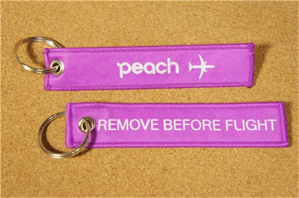 Peach Aviation Airlines In fFight Sales Limited Supprimer avant le porte-clés de vol 13 x 2,8 cm 100pcs / lot
