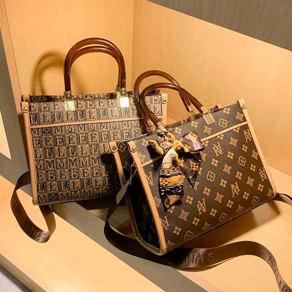 

2022 factory wholesale high sense bag women's autumn and winter versatile high-capacity tote fashion atmosphere single shoulder messeng