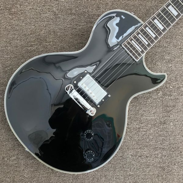 

black electric guitar, rosewood fingerboard, a piece of pickup, solid mahogany body