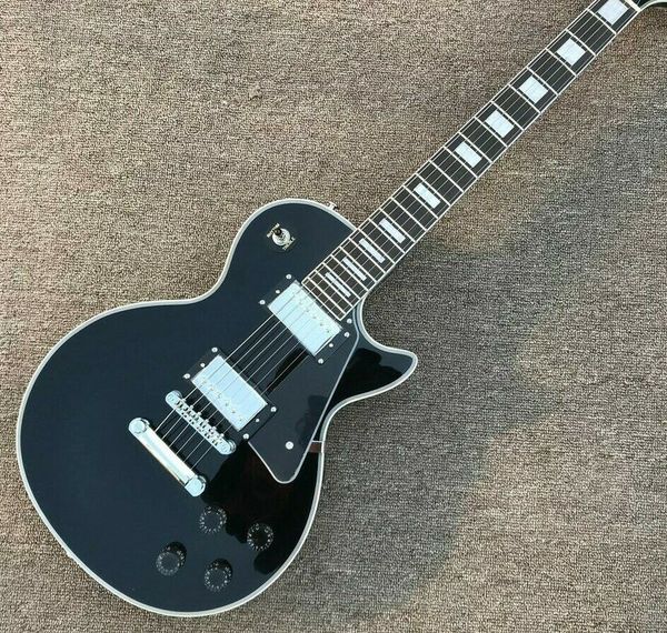 

black w/ chrome hardware style electric guitar