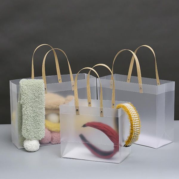 

gift wrap frosted pp bags with paper handle high-quality semitransparent plastic bag hard package christmas cloth accessories