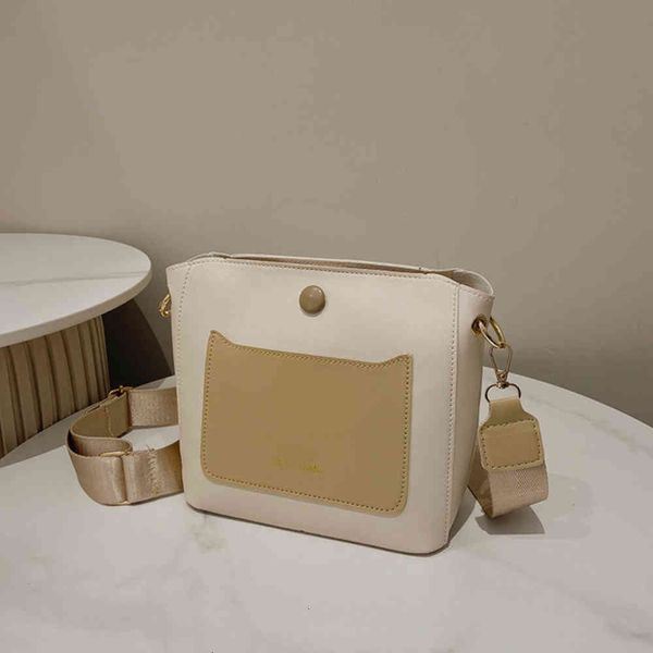 

a.popular color contrast bucket bag women's 2021 autumn new simple temperament single shoulder wide belt messenger