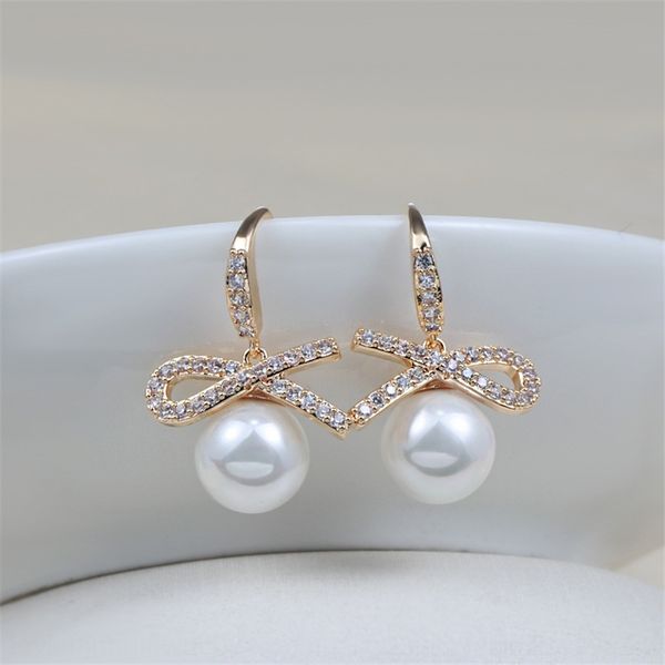 

fdx korean fashion women's bow pearl celebrity long versatile japanese accessories butterfly rings and korean temperament stud rings ea, Golden;silver